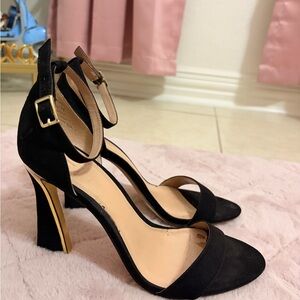 Jennifer Lopez Black and Gold Heels